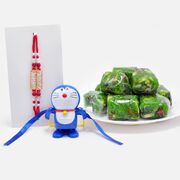 Auspicious Wahe Guru and Doraemon Rakhi Set with Flavoursome Kaju Anjeer Dryfruit