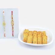 Soft Ajwain Biscuits with Designer White Beaded Rakhi and Auspicious Ganesha Rakhi
