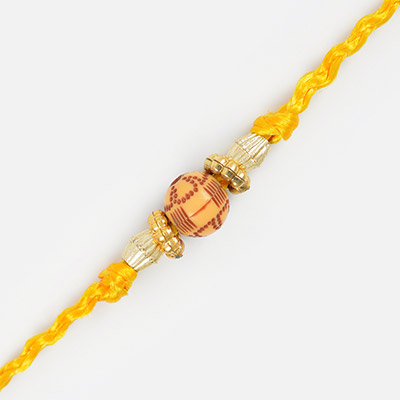 Wooden Brown Shadded Ball with Yellow Thread Rakhi