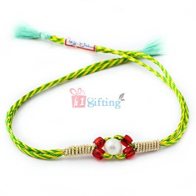 Natural color of green centered with pearl and red beads Rakhi