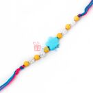 Denim art of blue flower silver crystals in thread Rakhi