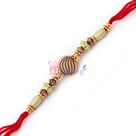 Attractive golden beads with sandalwood wave and thread Rakhi